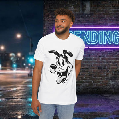 A man wearing a white crewneck t-shirt with a black and white cartoon dog graphic, standing in front of a brick wall with a neon sign.
