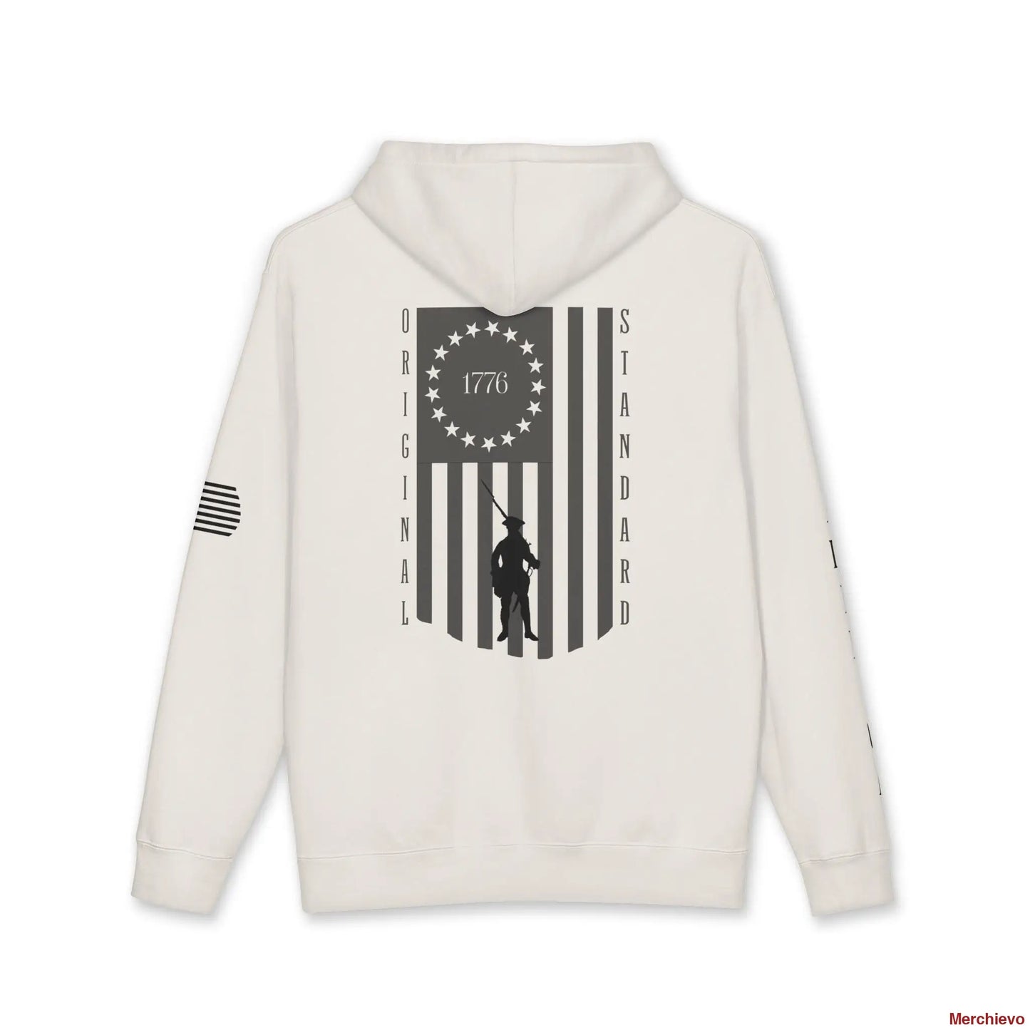 Back view of a Bone-colored hoodie featuring a large vertical American flag graphic. The flag's union contains a circle of 13 stars with "1776" in the center, and a silhouette of a colonial Minuteman is superimposed over the stripes. The words "ORIGINAL" and "STANDARD" run vertically down the left and right sides of the flag.