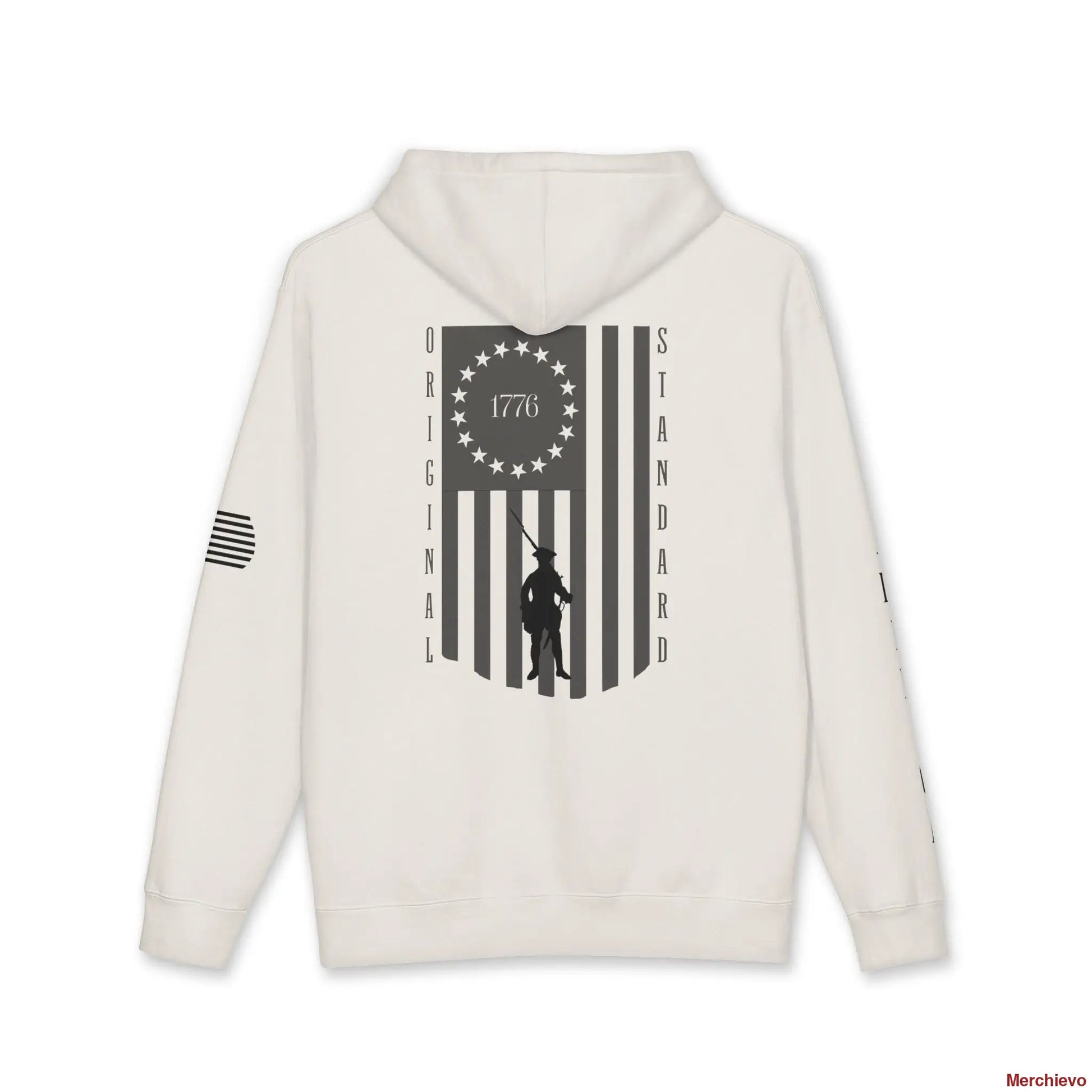 Back view of a Bone-colored hoodie featuring a large vertical American flag graphic. The flag's union contains a circle of 13 stars with "1776" in the center, and a silhouette of a colonial Minuteman is superimposed over the stripes. The words "ORIGINAL" and "STANDARD" run vertically down the left and right sides of the flag.
