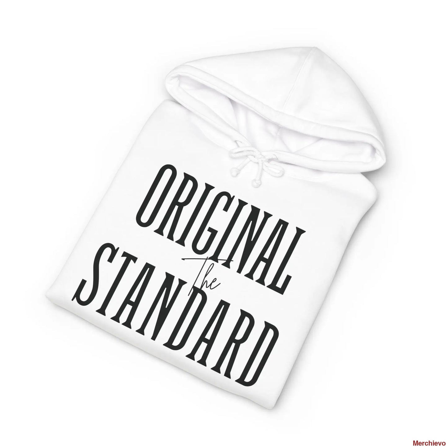 A white heavyweight hoodie neatly folded, highlighting the chest graphic which features the words "ORIGINAL STANDARD" in a large, black, vintage serif font with "The" written in a small script font in the center.