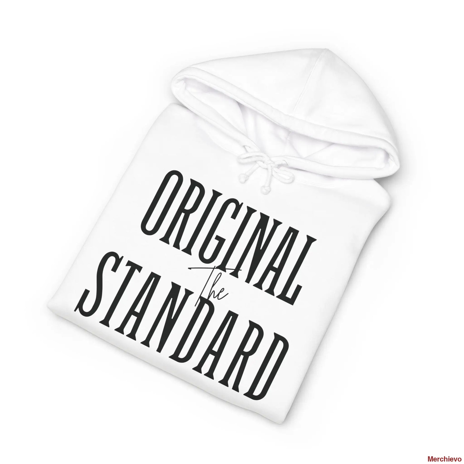 A white heavyweight hoodie neatly folded, highlighting the chest graphic which features the words "ORIGINAL STANDARD" in a large, black, vintage serif font with "The" written in a small script font in the center.
