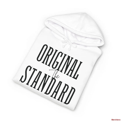 A white heavyweight hoodie neatly folded, highlighting the chest graphic which features the words "ORIGINAL STANDARD" in a large, black, vintage serif font with "The" written in a small script font in the center.
