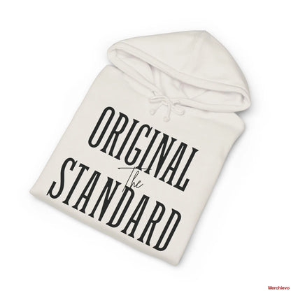 A neatly folded heavyweight hoodie in Bone (off-white), showcasing the "THE ORIGINAL STANDARD" chest graphic in bold black vintage serif typography. The plush fleece interior of the hood is visible at the top.