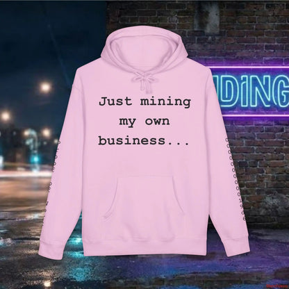 Pink hoodie with text 'Just mining my own business...' against a nighttime city street background.