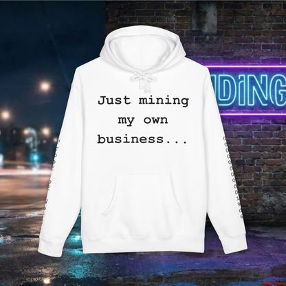 Clean, professional "Just mining my own business..." typography centered on a premium white heavyweight hoodie.