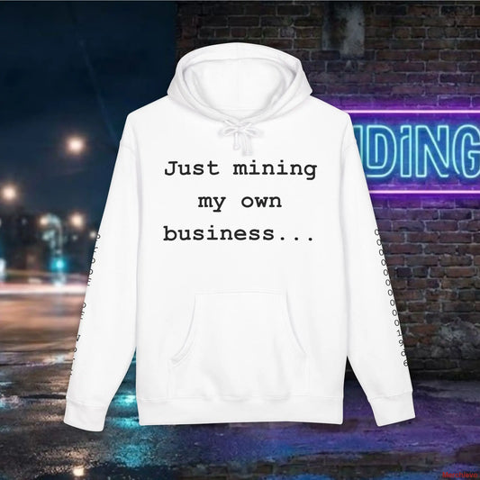 Clean, professional "Just mining my own business..." typography centered on a premium white heavyweight hoodie.