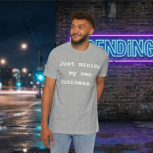 Minimalist "Just mining my own business" text in a modern sans-serif font centered on a white premium cotton jersey t-shirt.