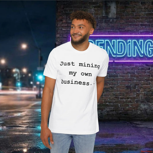 Minimalist "Just mining my own business" text in a modern sans-serif font centered on a white premium cotton jersey t-shirt.